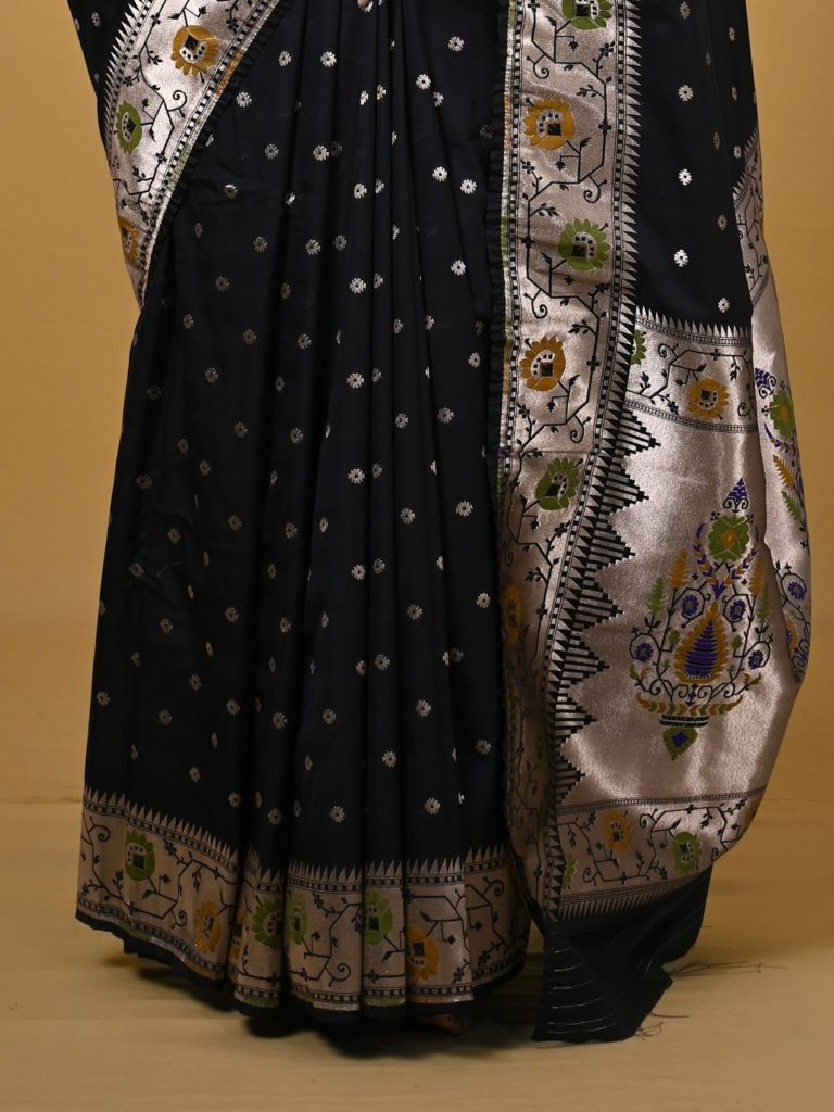 Banaras pattu fancy saree in black color allover zari motifs and paithani border paired with plain blouse