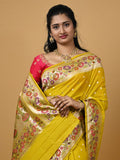 Banaras pattu fancy saree in yellow color allover zari motifs and paithani border paired with plain blouse