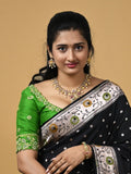 Banaras pattu fancy saree in black color allover zari motifs and paithani border paired with plain blouse