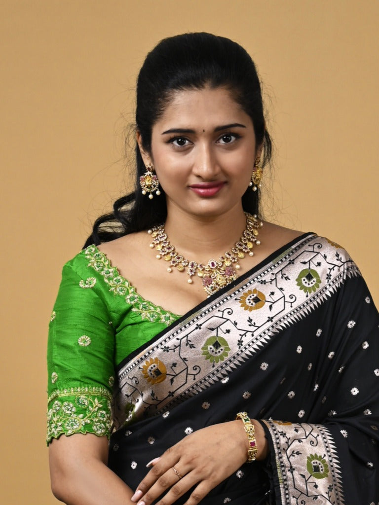 Banaras pattu fancy saree in black color allover zari motifs and paithani border paired with plain blouse
