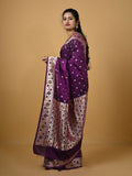 Banaras pattu fancy saree in violet color allover zari motifs and paithani border paired with plain blouse