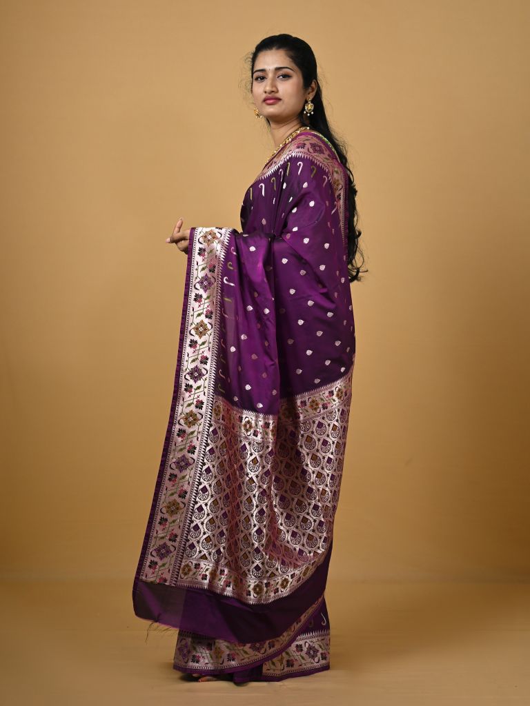 Banaras pattu fancy saree in violet color allover zari motifs and paithani border paired with plain blouse