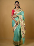 Banaras pattu fancy saree in light blue color allover zari motifs and paithani border paired with plain blouse