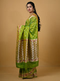 Banaras pattu fancy saree in parrot green color allover zari motifs and paithani border paired with plain blouse