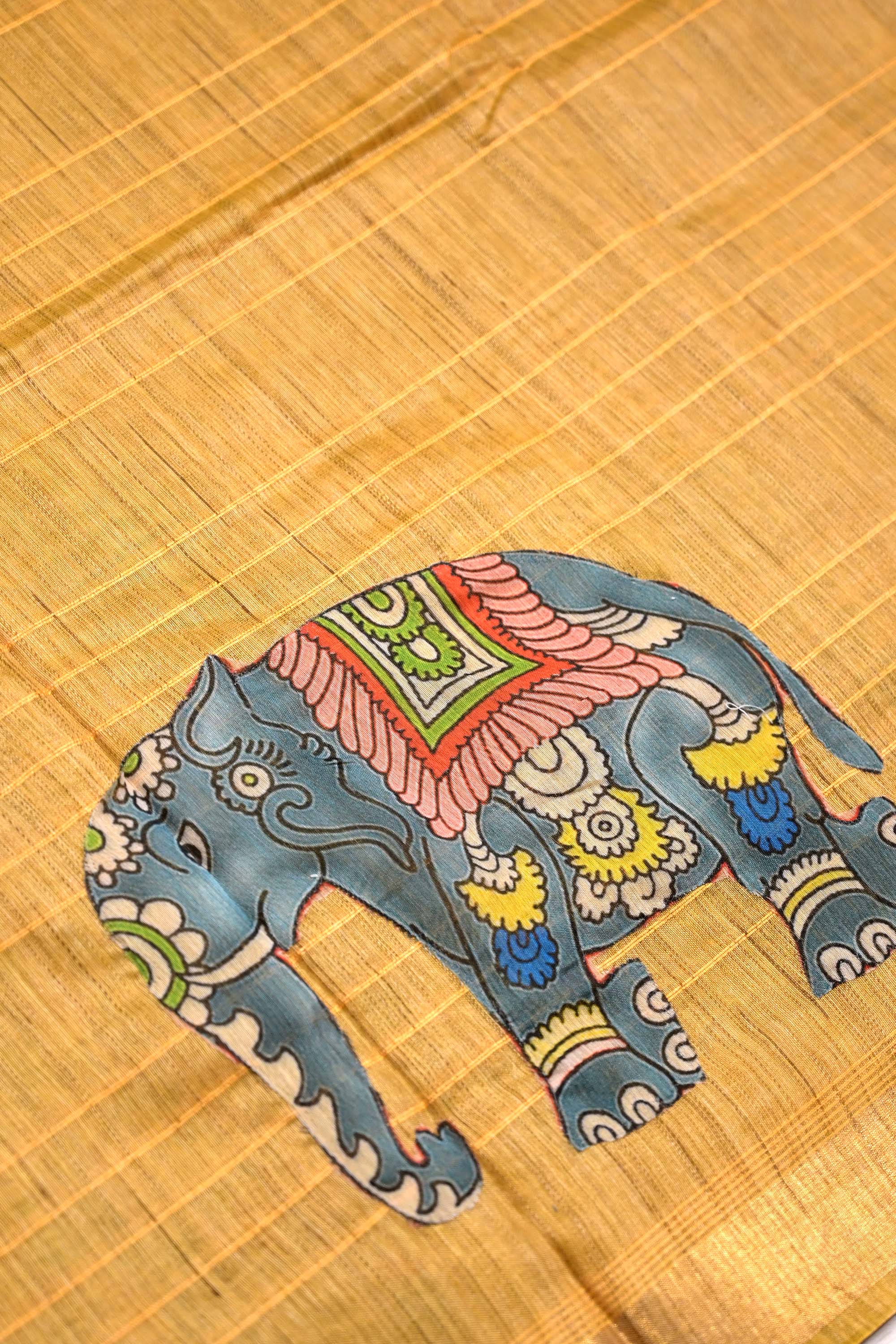 Tussar jute saree yellow color with kalamkari prints, big printed pallu, small kaddi border and printed blouse