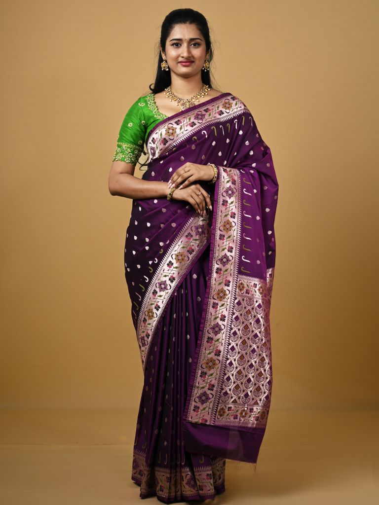 Banaras pattu fancy saree in violet color allover zari motifs and paithani border paired with plain blouse