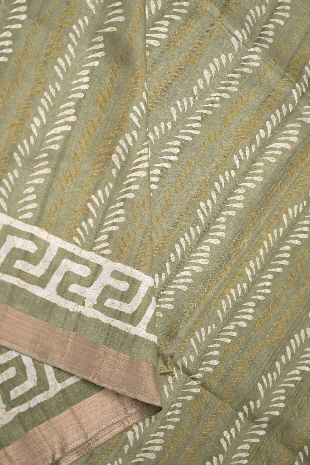 Jute tussar fancy sea green color allover prints & small printed kaddi border with attached printed blouse