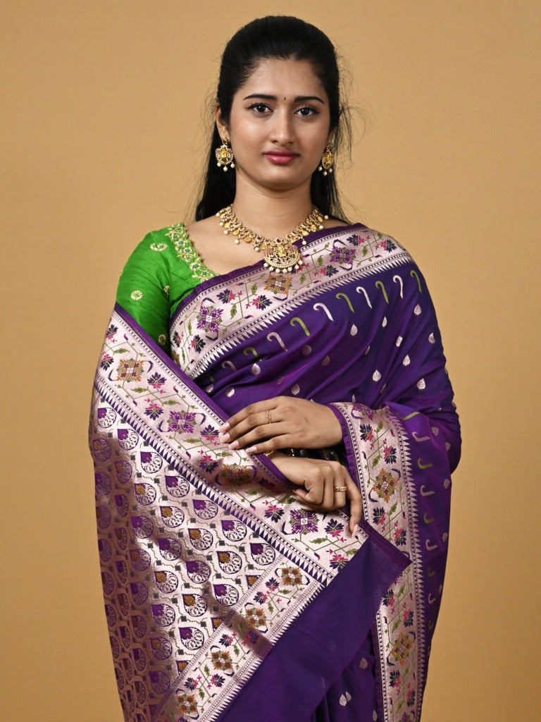 Banaras pattu fancy saree in blue color allover zari motifs and paithani border paired with plain blouse