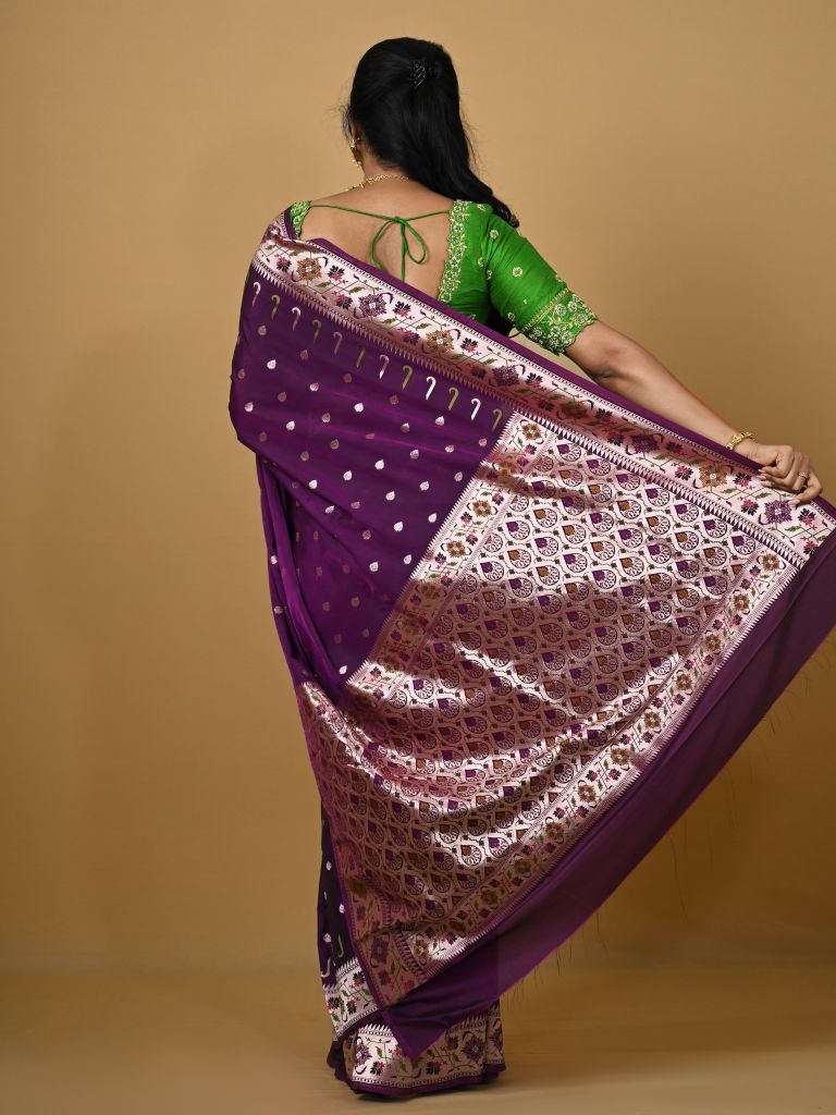 Banaras pattu fancy saree in violet color allover zari motifs and paithani border paired with plain blouse