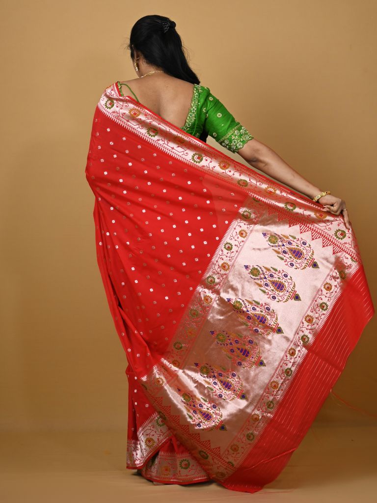 Banaras pattu fancy saree in red color allover zari motifs and paithani border paired with plain blouse