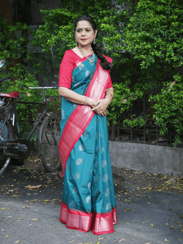 Gadwal pattu saree peacock blue color allover zari motifs & zari border with contrast pallu and blouse