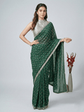 Chinnon fancy saree dark green color allover motifs & embroidery border with running pallu and contrast blouse