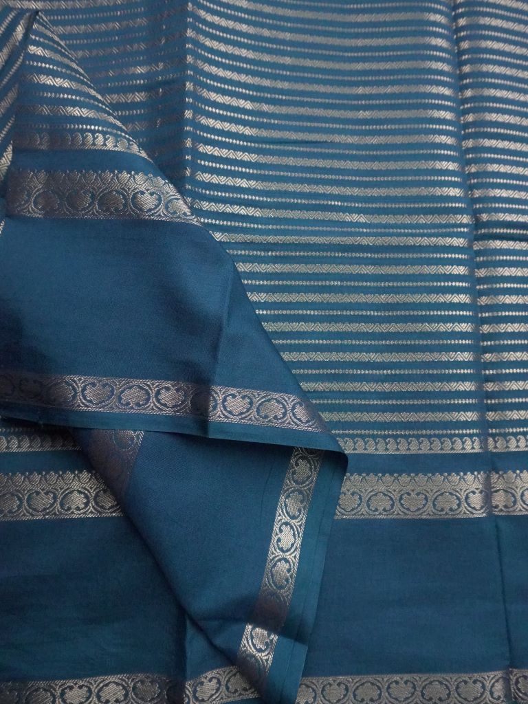 Banaras fancy saree peacock green color with allover zari stripes, gap border with brocade pallu and attached blouse