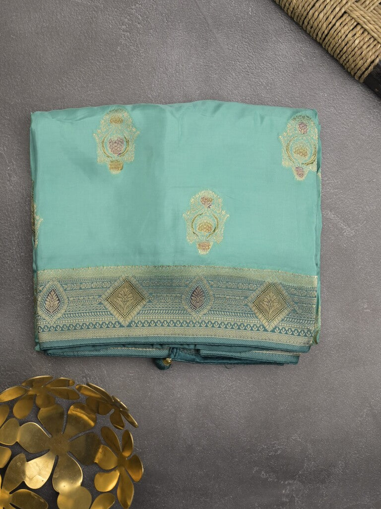 Dola silk fancy saree sky blue color allover prints & zari border with printed pallu and attached blouse