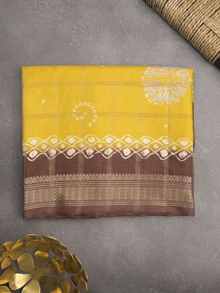 Dola silk fancy saree golden yellow color allover prints & zari border with printed pallu and attached blouse