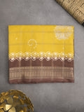 Dola silk fancy saree golden yellow color allover prints & zari border with printed pallu and attached blouse