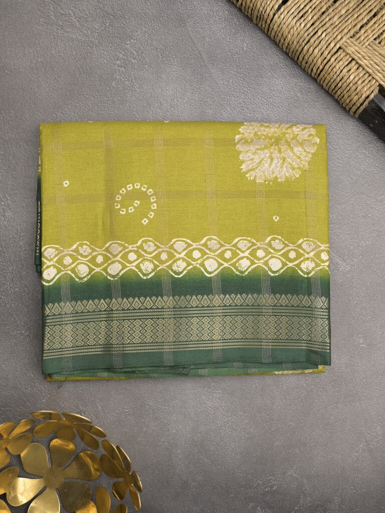 Dola silk fancy saree greenish yellow color allover prints & zari border with printed pallu and attached blouse