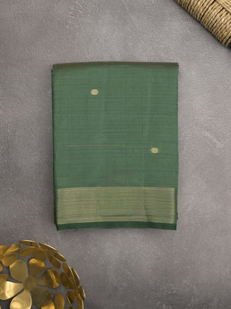 Dupion fancy saree bottle green color allover zari motifs & zari border with short pallu and attached blouse