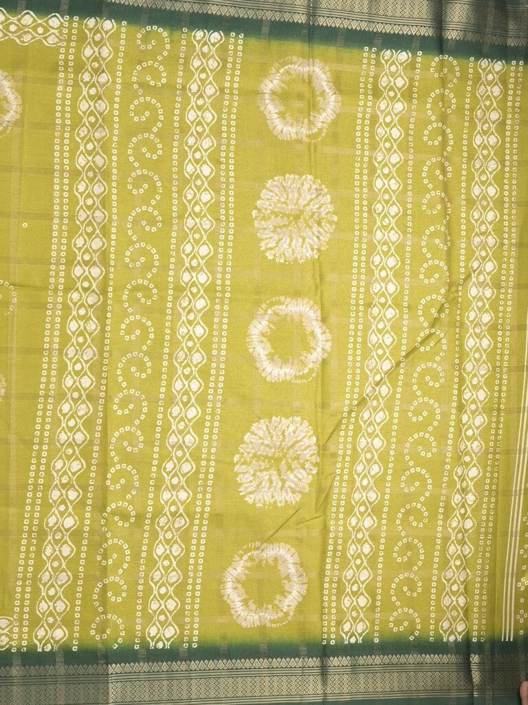 Dola silk fancy saree greenish yellow color allover prints & zari border with printed pallu and attached blouse
