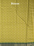 Dola silk fancy saree greenish yellow color allover prints & zari border with printed pallu and attached blouse