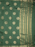 Dupion fancy saree bottle green color allover zari weaves & zari border with short pallu and attached blouse