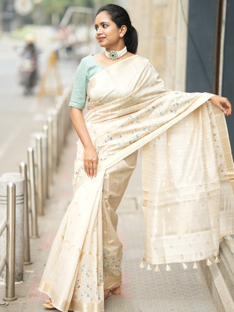 Jute tussar fancy saree cream color allover zari weaves & embroidery, zari border with short pallu and attached self blouse