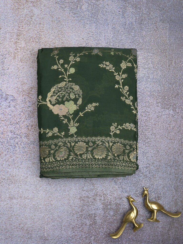 Chinnon fancy saree dark green color allover zari weaves & zari border with rich pallu and plain blouse