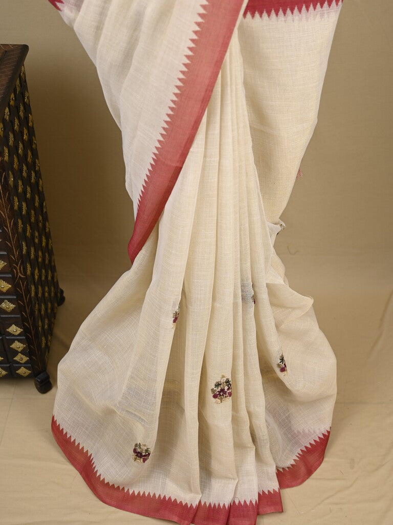 Lenin tissue embroidered fancy saree in cream color with embroidery pallu and matching blouse
