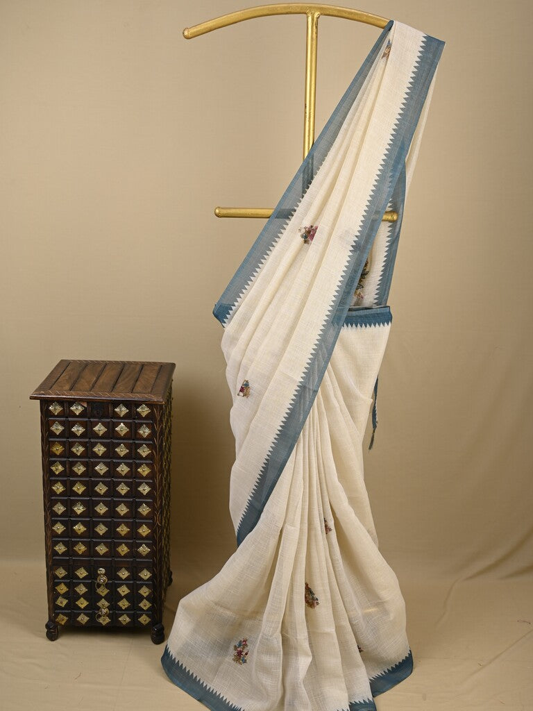 Lenin tissue embroidered fancy saree in cream color with embroidery pallu and matching blouse