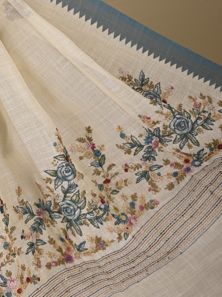 Lenin tissue embroidered fancy saree in cream color with embroidery pallu and matching blouse