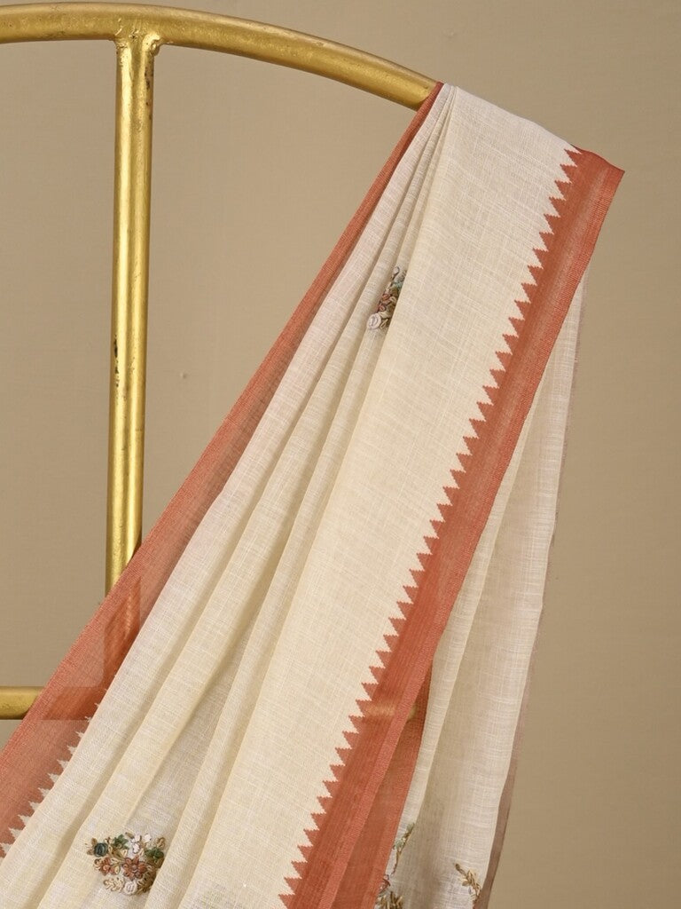 Lenin tissue embroidered fancy saree in cream color with embroidery pallu and matching blouse