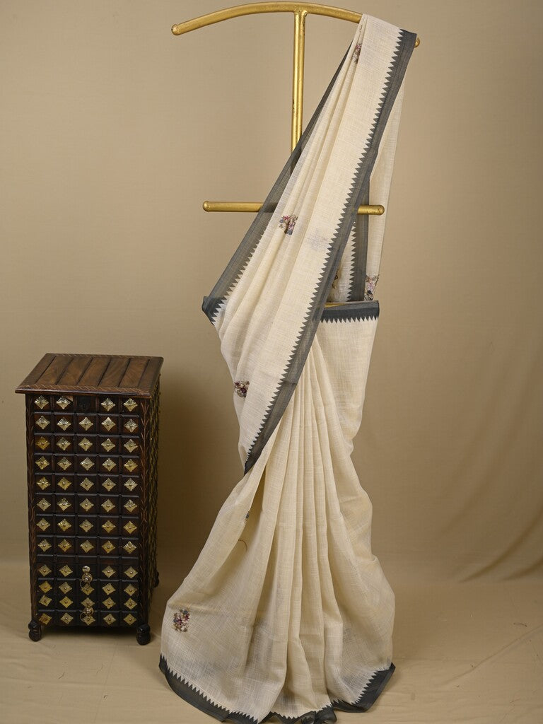 Lenin tissue embroidered fancy saree in cream color with embroidery pallu and matching blouse