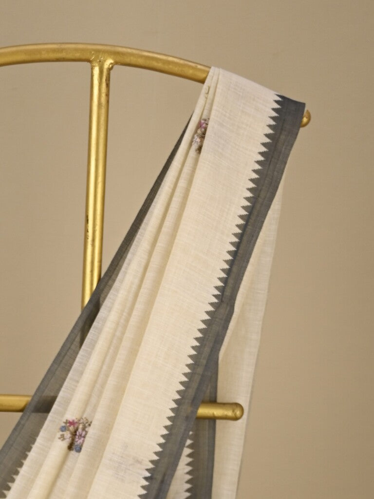 Lenin tissue embroidered fancy saree in cream color with embroidery pallu and matching blouse