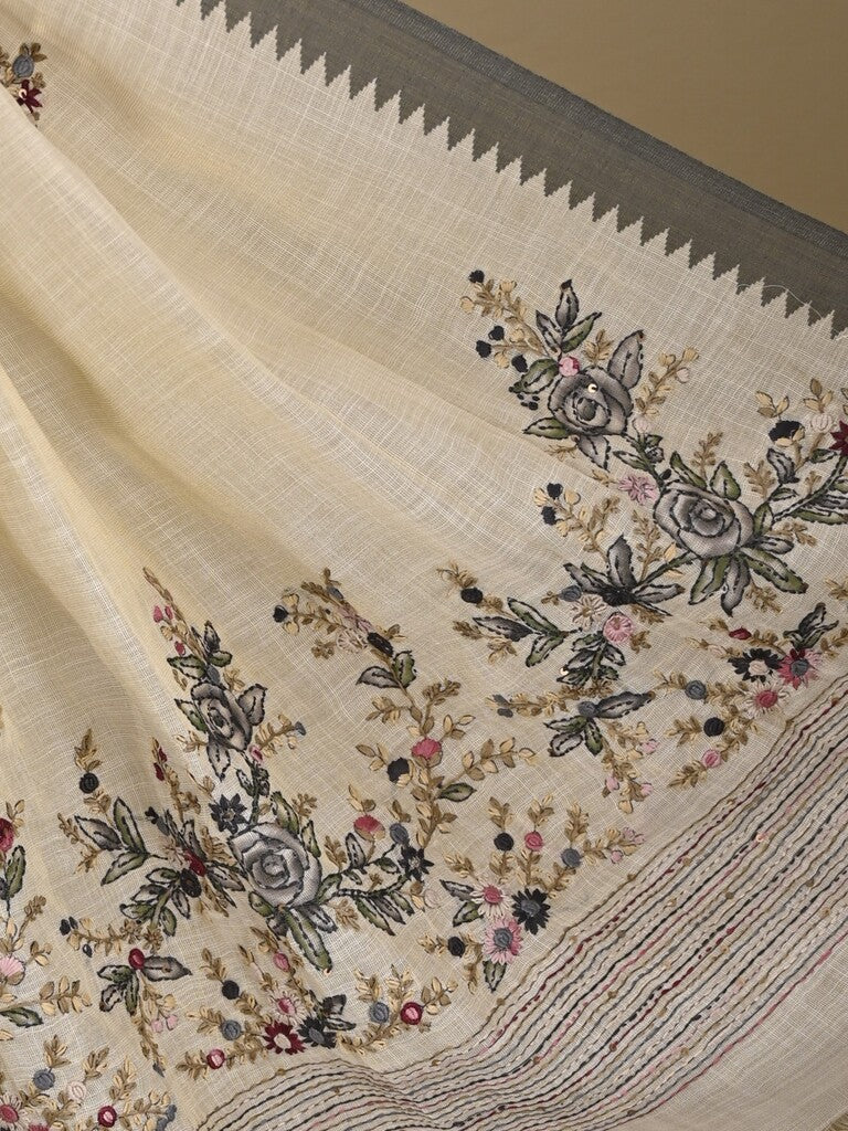 Lenin tissue embroidered fancy saree in cream color with embroidery pallu and matching blouse