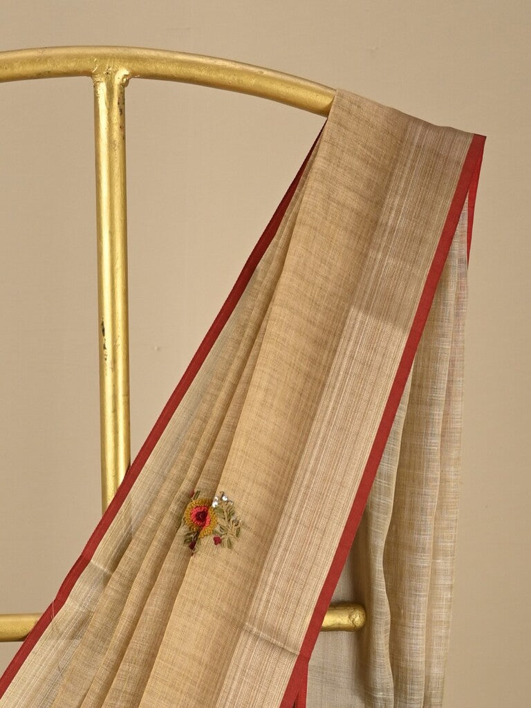 Lenin tissue embroidered fancy saree in light beige color with embroidery pallu and matching blouse