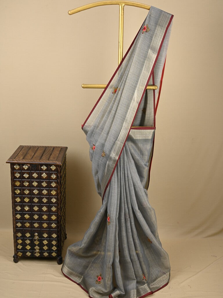 Lenin tissue embroidered fancy saree in light grey color with embroidery pallu and matching blouse