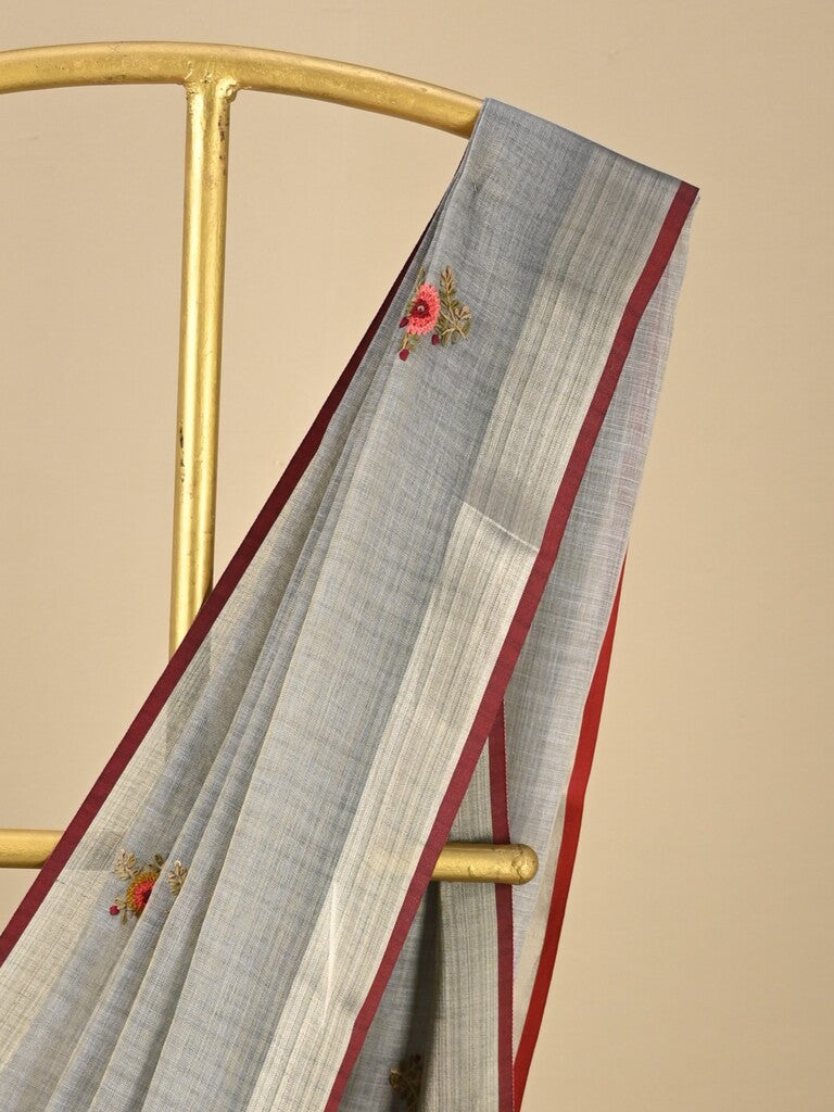 Lenin tissue embroidered fancy saree in light grey color with embroidery pallu and matching blouse