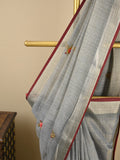 Lenin tissue embroidered fancy saree in light grey color with embroidery pallu and matching blouse