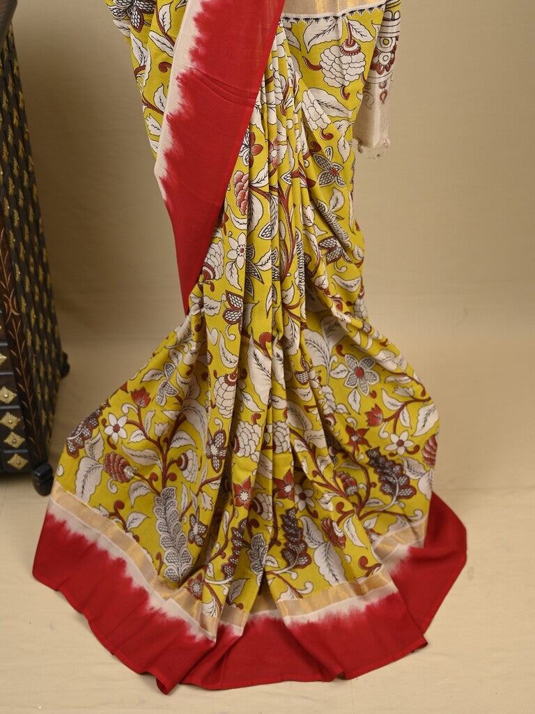 Kalamkari silk saree in yellow, featuring a contrast color border and plain matching blouse