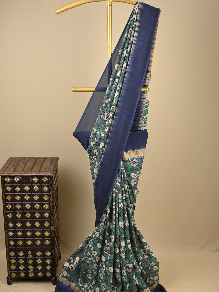 Kalamkari silk saree in blue, featuring a contrast color border and plain matching blouse