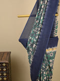Kalamkari silk saree in blue, featuring a contrast color border and plain matching blouse