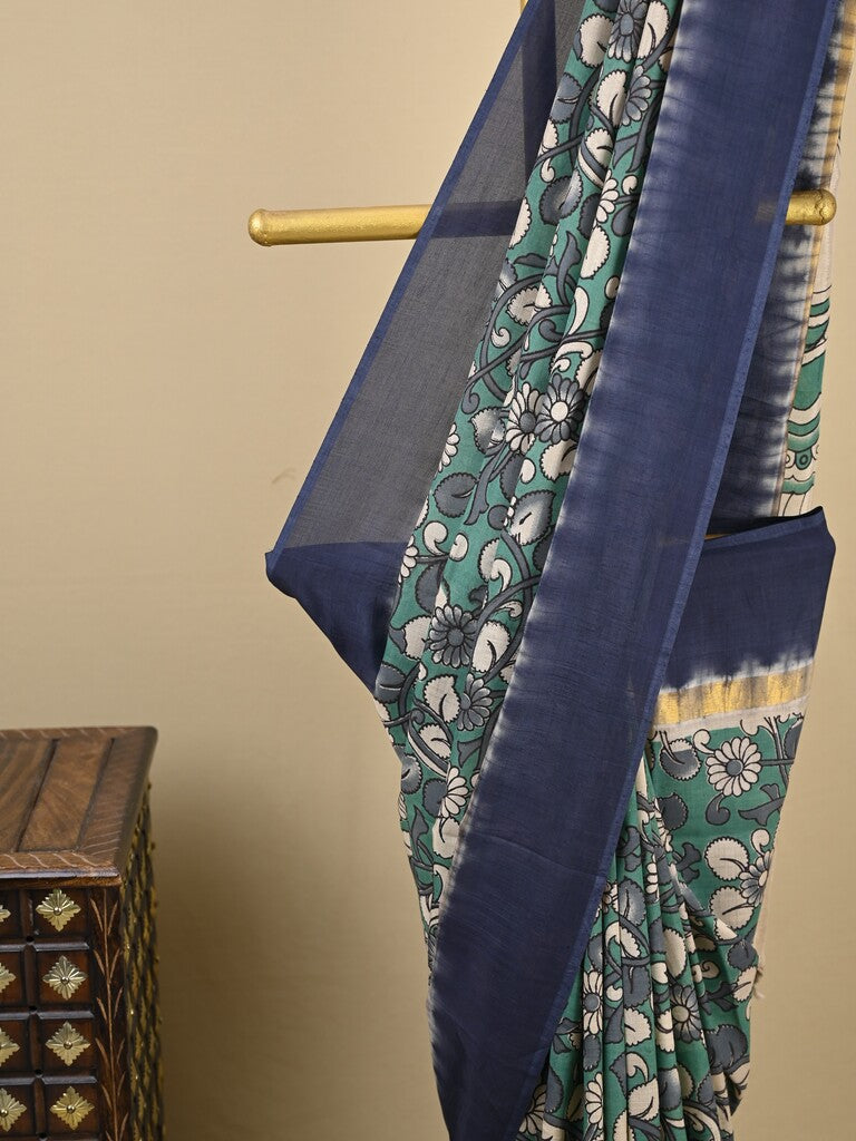 Kalamkari silk saree in blue, featuring a contrast color border and plain matching blouse