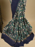 Kalamkari silk saree in blue, featuring a contrast color border and plain matching blouse