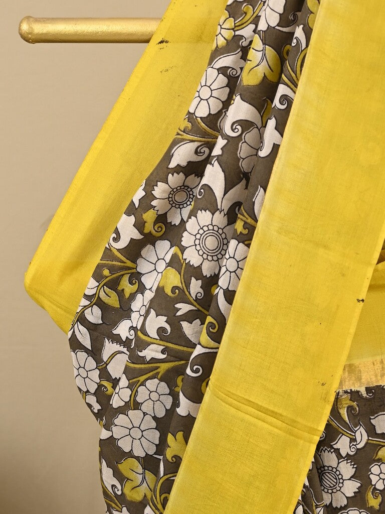 Kalamkari silk saree in brown, featuring a contrast color border and plain matching blouse