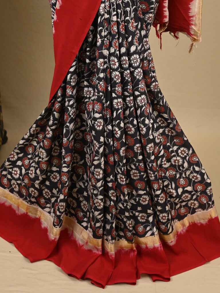 Kalamkari silk saree in black, featuring a contrast color border and plain matching blouse