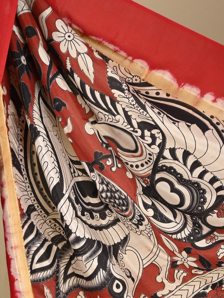 Kalamkari silk saree in black, featuring a contrast color border and plain matching blouse