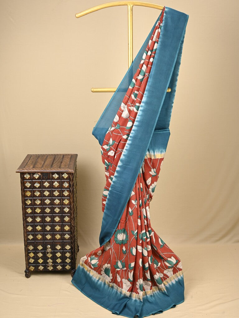 Kalamkari silk saree in red, featuring a contrast color border and plain matching blouse