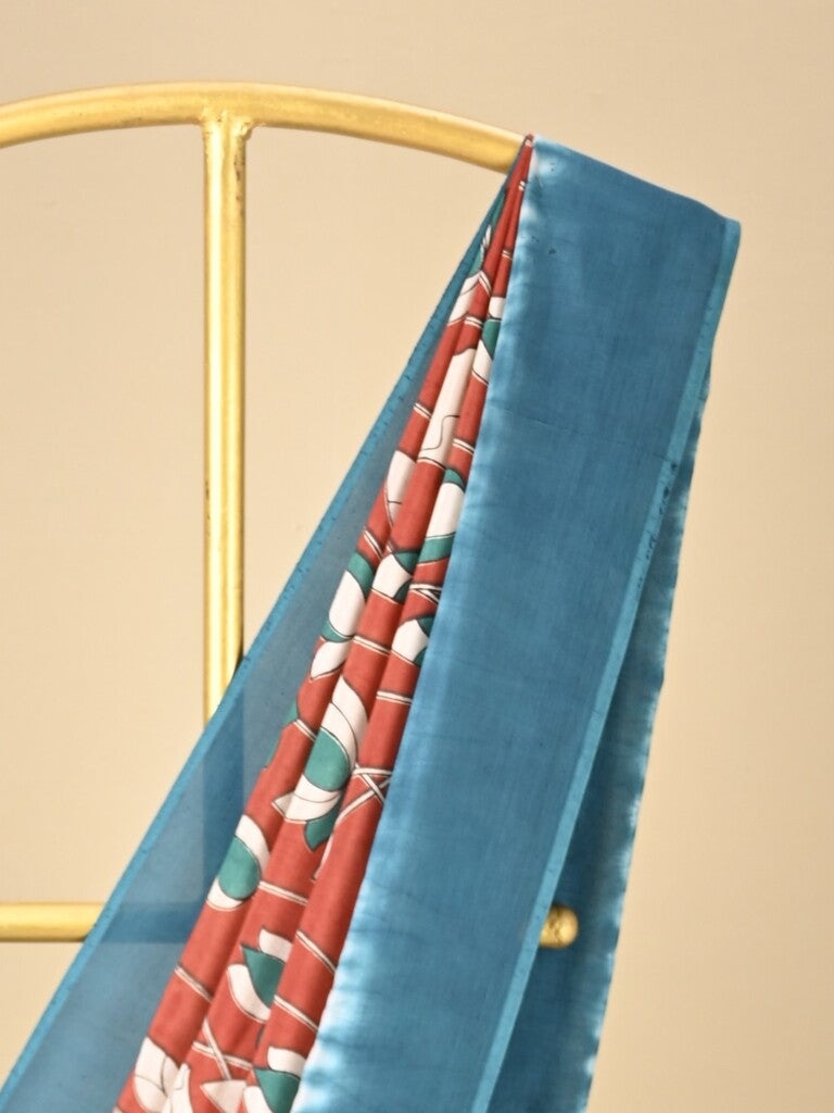 Kalamkari silk saree in red, featuring a contrast color border and plain matching blouse