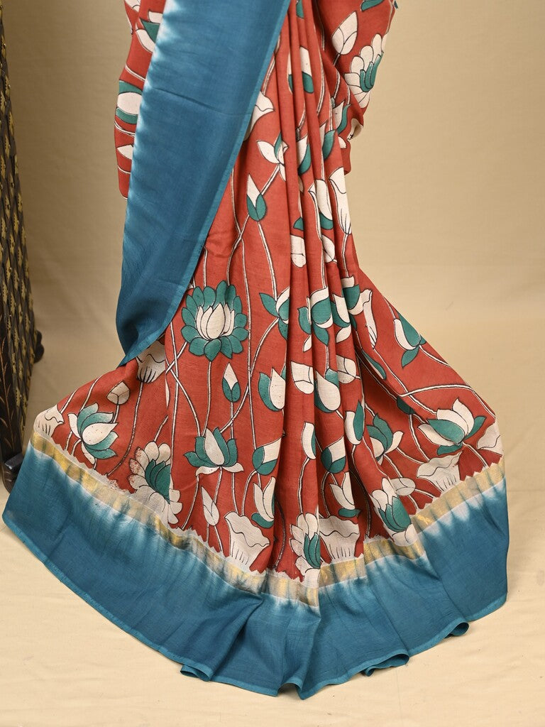 Kalamkari silk saree in red, featuring a contrast color border and plain matching blouse