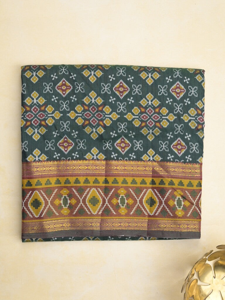 Ikkath fancy saree in dark green color allover design with zari border & ikkath pallu and plain blouse